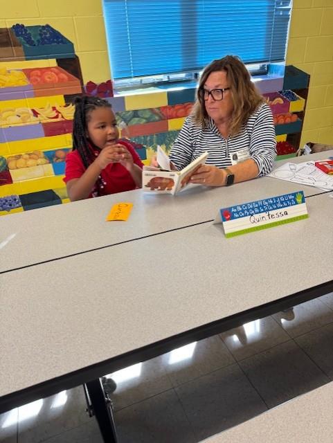 student with a reader